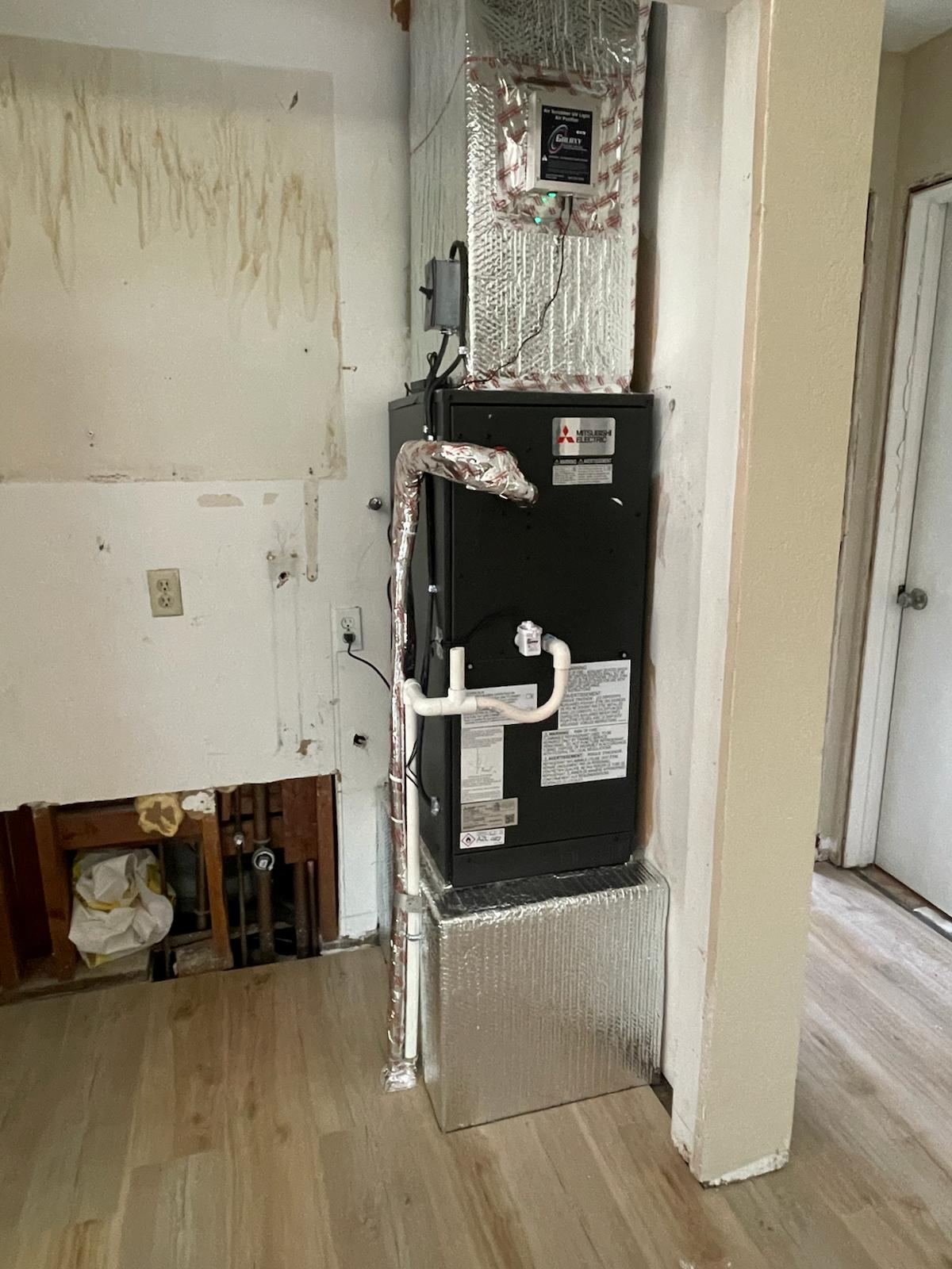 Mitsubishi ducted indoor heat pump air handler installed in a Bay Area home